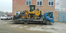 Эвакуация экскаватора по городу 